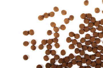 Naklejka premium Dry dog food isolated on white background, top view