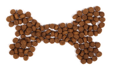 Dry dog food in bone shape isolated on white background, top view