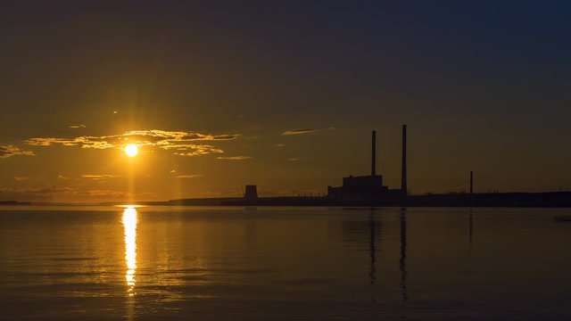 Sunset at power plant. Timelapse
