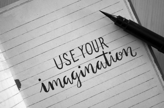 USE YOUR IMAGINATION hand-lettered in notebook