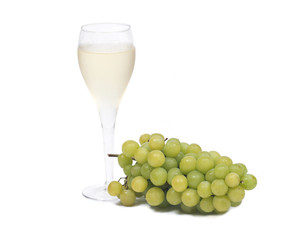 Glass of white wine and ripe organic green grapes isolated on white background