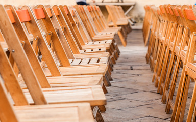 Row of wooden chairs from side