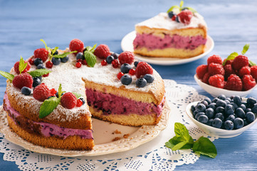 Delicious homemade cake with berry cheese cream.