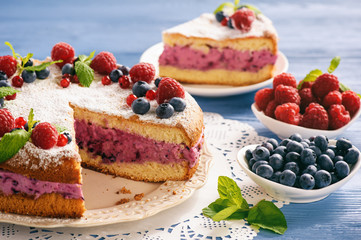 Delicious homemade cake with berry cheese cream.