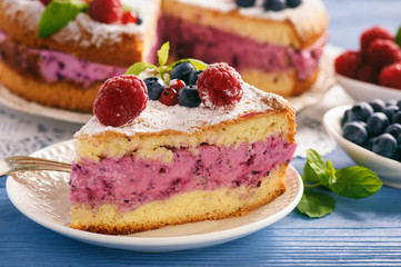 Delicious homemade cake with berry cheese cream.