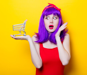 girl with purple color hair and supermarket cart © Masson