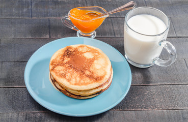 Small pancakes on a blue plate