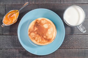 Small pancakes on a blue plate