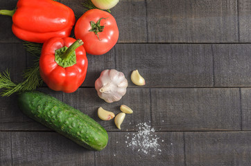 Fresh vegetables on a dark wooden background