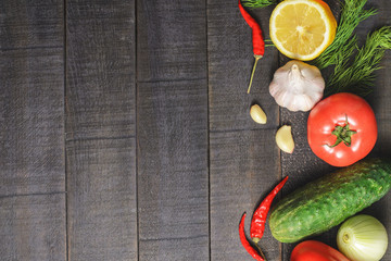 Fresh vegetables on a dark wooden background