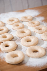Fototapeta na wymiar Chef preparing dough - cooking donuts process