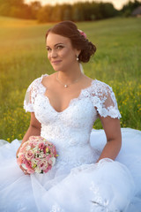 Fototapeta na wymiar Young beautiful bride in nature