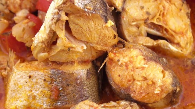 Fried pollock with onions