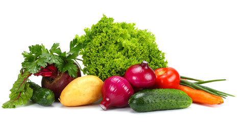 Assortment of fresh raw vegetables isolated on white background. Tomato, cucumber, onion, salad, carrot, beetroot, potato