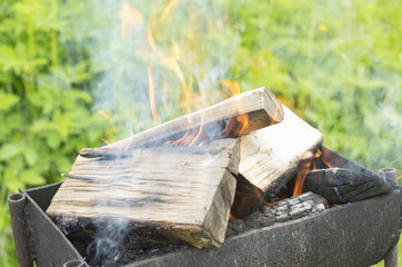 Smoking firewood in a brazier gradually turning into coals