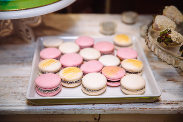 Tasty colorful macaroons on plate