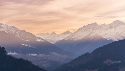 Fototapeta na wymiar Sunset over snowy Swiss mountains