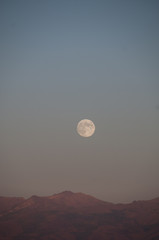 Moon over the mountains in Utah desert