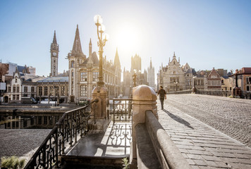 Beautiful view on the old town from saint Nicholas bridge during the sunrise in Gent city, Belgium