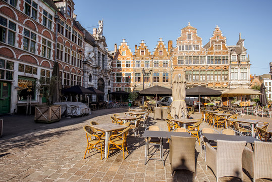 View on the square with cafes and restaurants during the morning light in Gent city, Belgium