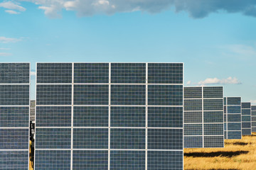 Solar panels of a power station, standing in a row, close-up