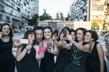 Group of persons in the street with smartphone