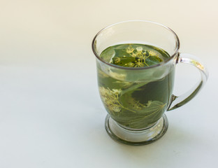 cup of linden herbal tea infusion
