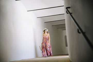 Woman walking along the corridor