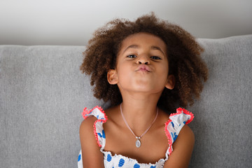 girl with afro hair making funny face