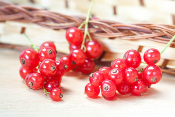 Red currant berries on wooden  background, bright colors motif decorative wallpaper. 