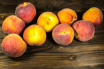 Ripe peaches on wooden table