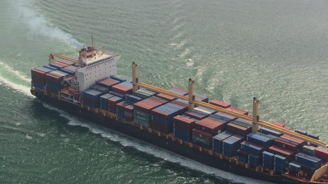 Hong Kong Aerial v165 Birdseye view flying low around large cargo ship passing by 2/17