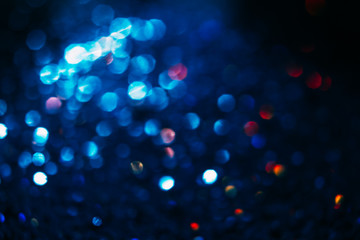 Abstract blur light bokeh, blue and red. Blurred glittering shine , night background. Christmas wallpaper decorations concept. New year holiday festive backdrop. Sparkle circle celebrations display.