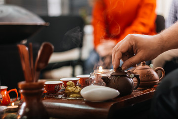 Tea ceremony. Hot chinese tea in teapots on the tea desk