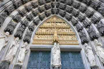 .Gothic cathedral in Cologne. High medieval walls, numerous sculptures and decorations - an old building in the city center.