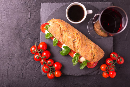 Ciabatta Sandwich With Caprese Salad With Wine And Coffee.