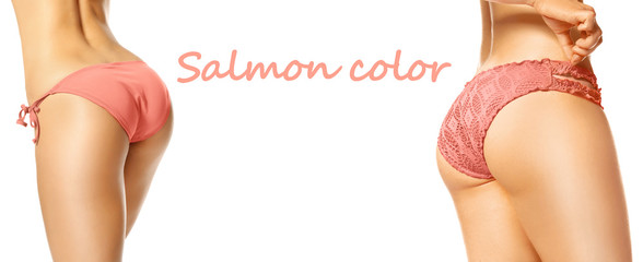 Young women in salmon color bikini on white background