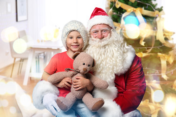 Fototapeta na wymiar Authentic Santa Claus with little boy and teddy bear at home. Christmas and New Year celebration