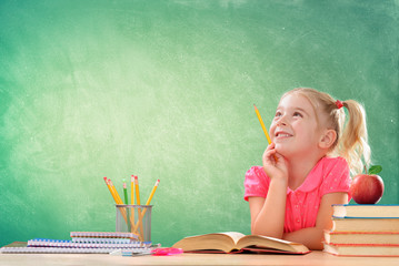 Little Student Thinking In Classroom
