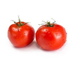 Two ripe red tomatoes isolated on white background