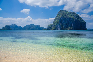 Fototapeta premium Huge Rock of Pinagbuyutan Island in blue ocean. Landscape of El Nido. Palawan island. Philippines