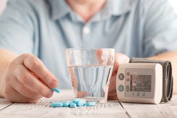 hand holding tablet, disease healing, blood pressure concept