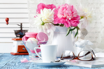 home decoration, fresh pink peonies on coffee table in white room