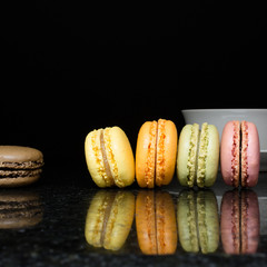 Square Composition of Five (5) French Macarons and a Tea Cup