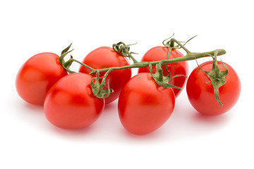 Small plum tomatoes on a white background.
