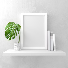 Clean and minimal mock up photo frame with books and green leaf decoration on a white shelf. 3D illustration render.