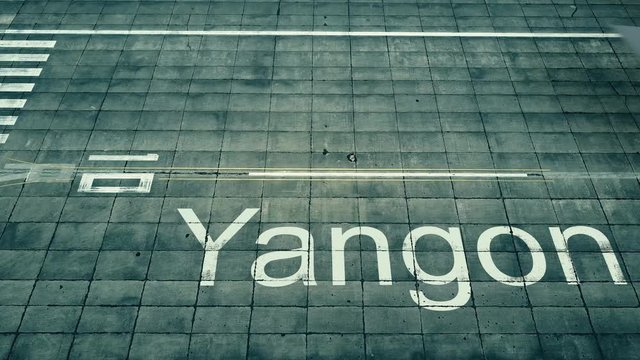 Aerial view of big airplane arriving to Yangon airport. Travel to Myanmar conceptual intro animation