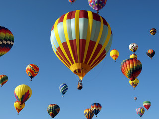 Colorful Hot Air Ballons Fly in a Clear Blue Sky