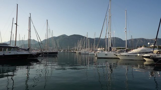 Seaside promenade in Budva, Montenegro, view of marina with boats and yachts