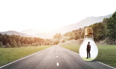 Businessman inside light bulb